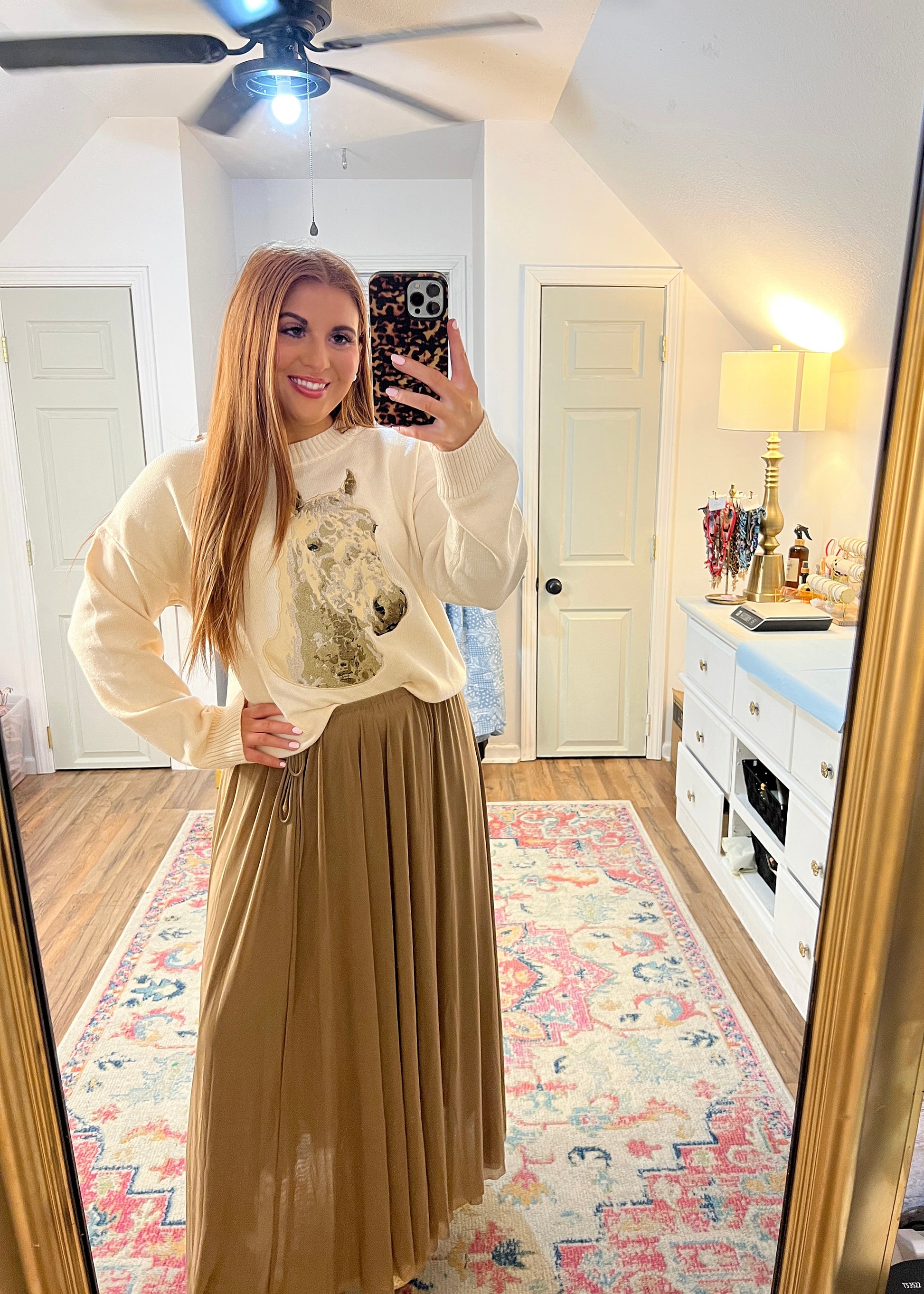 cream sweater with an embroidered horse on the front, paired with our wheat maxi skirt.