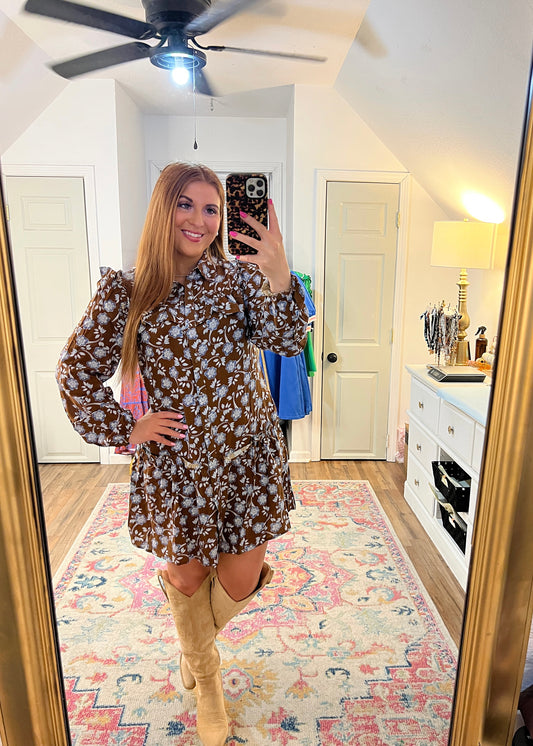 brown and blue floral dress with ruffles on the shoulder and buttons down the front 