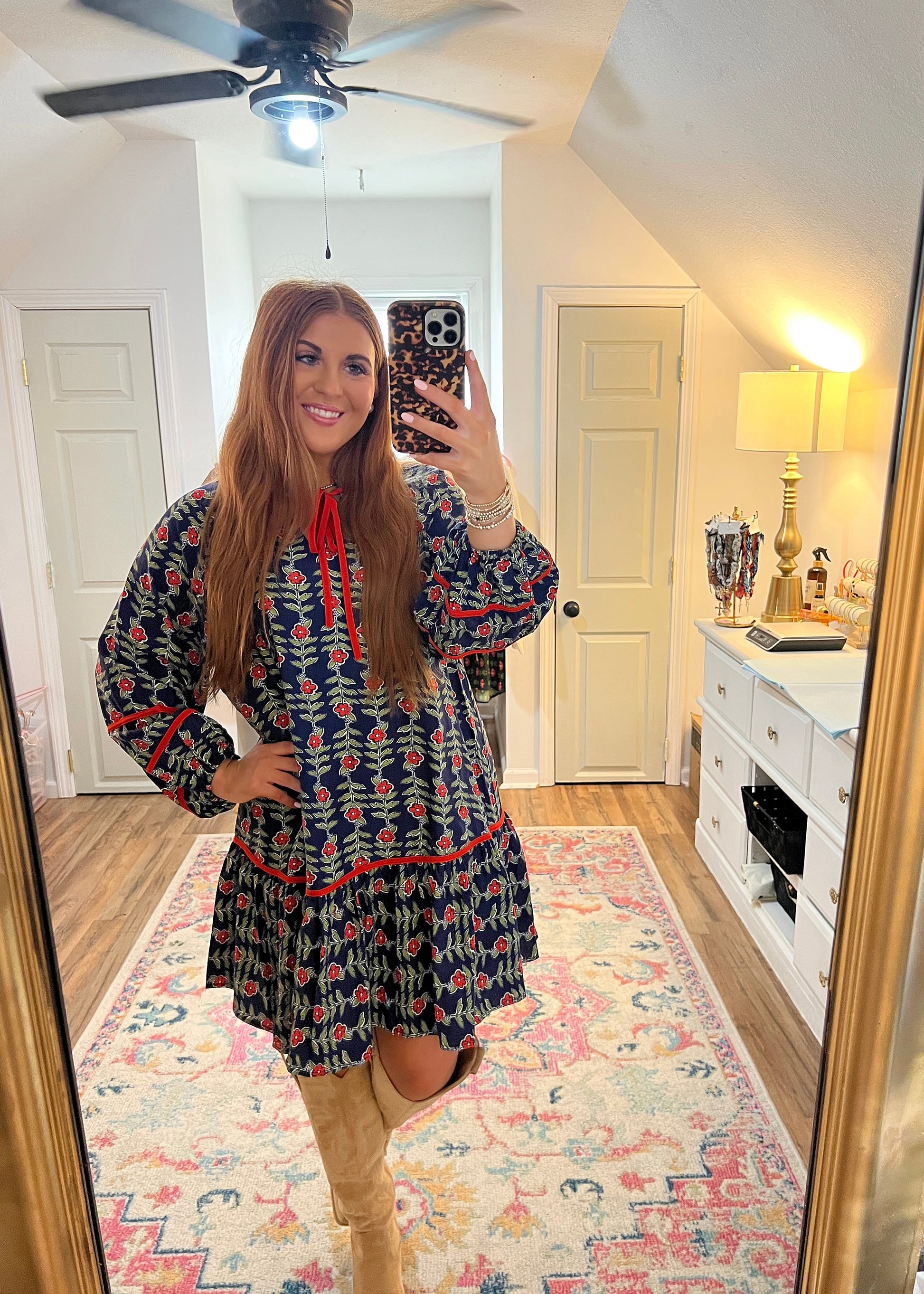 Ruffle dress with a blue and red floral print, front tie details 