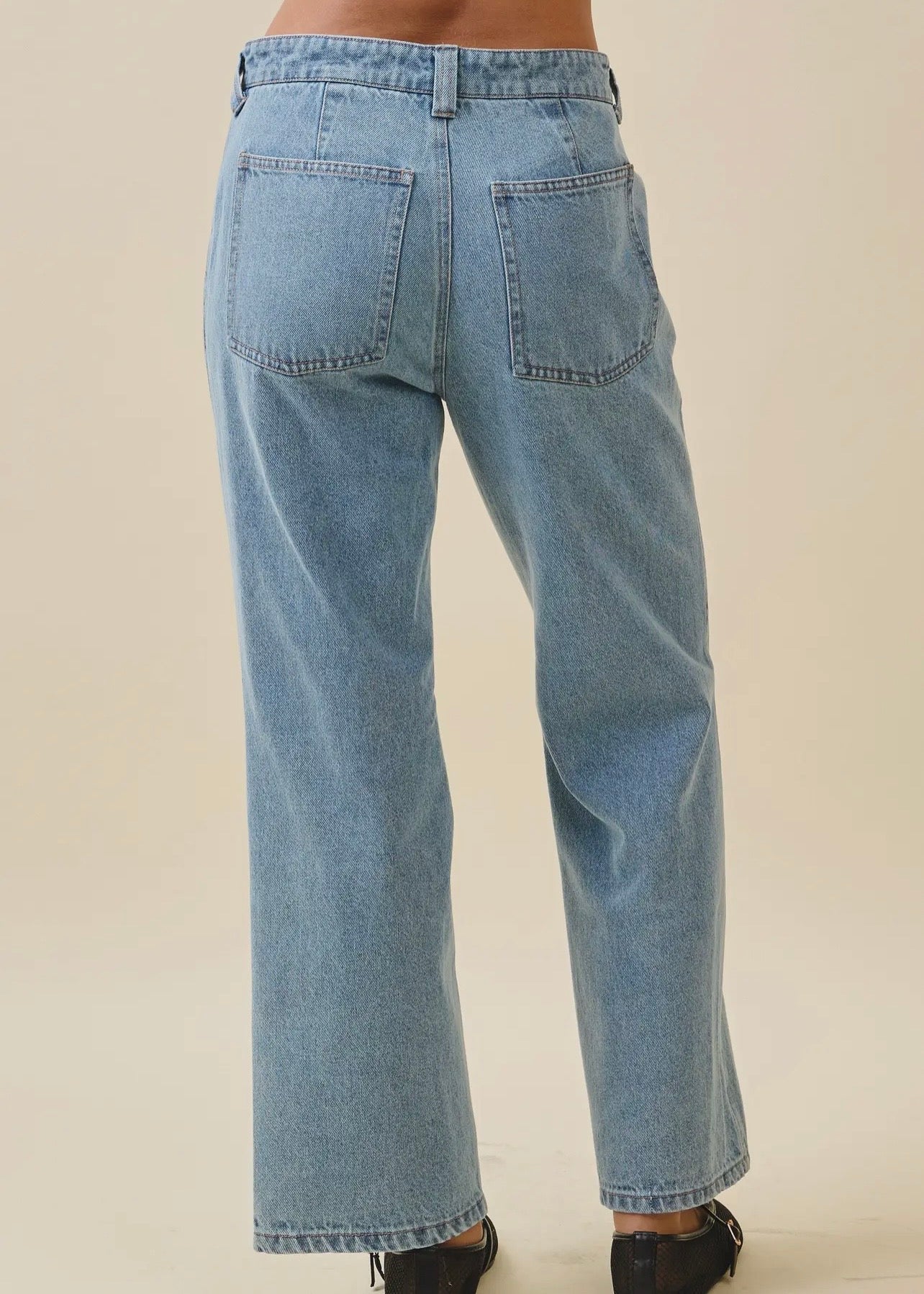 Back view of women’s patch pocket jeans