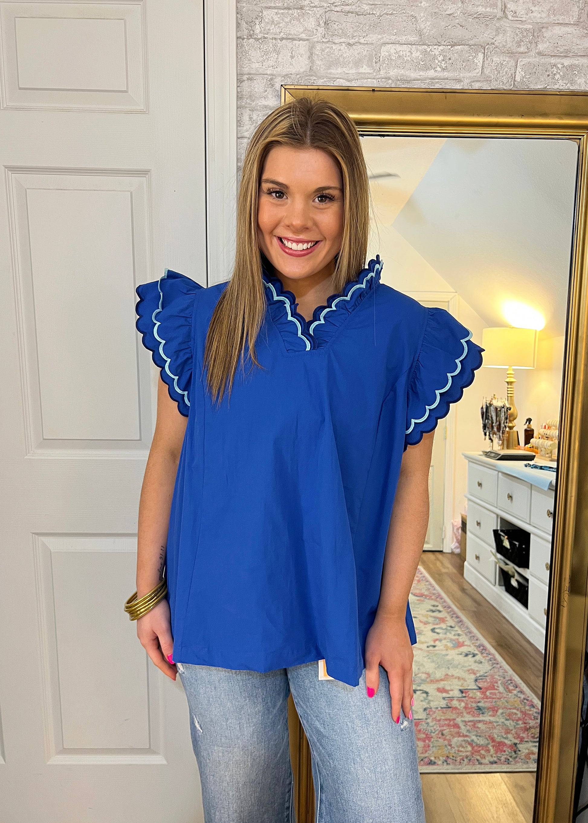 The Seaside Top featuring a breezy relaxed fit for casual summer style, ruffle sleeves