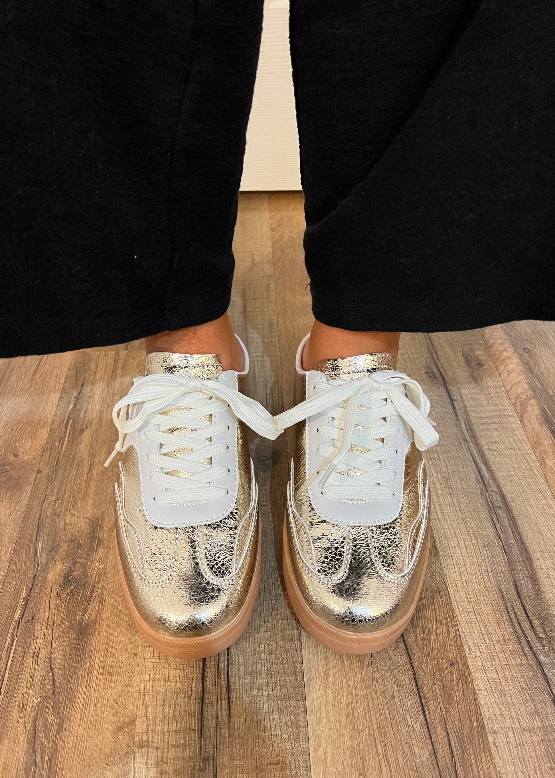 Women’s gold slip-on sneaker with tan sole