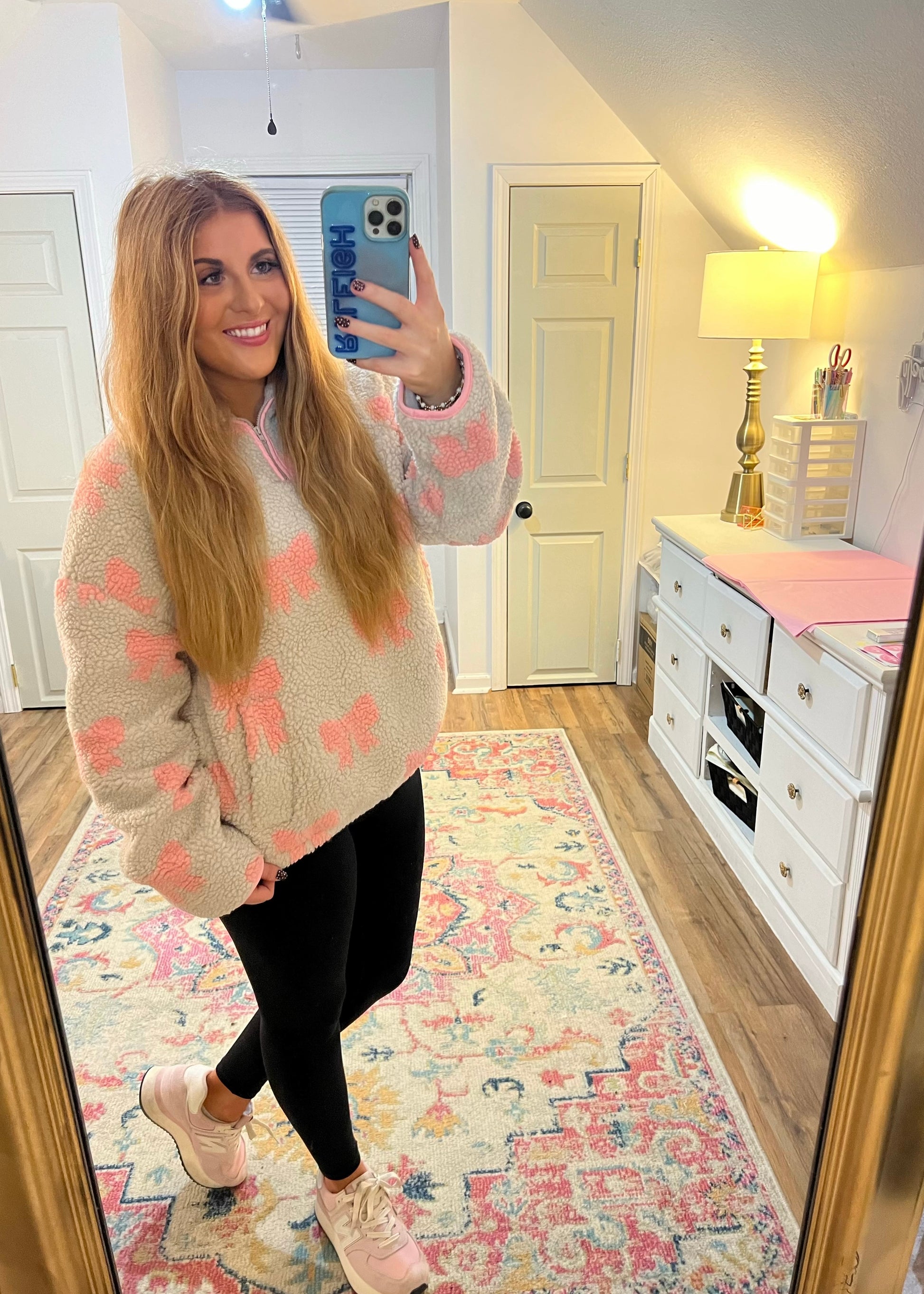 Cozy fleece pullover with bow design and quarter zip