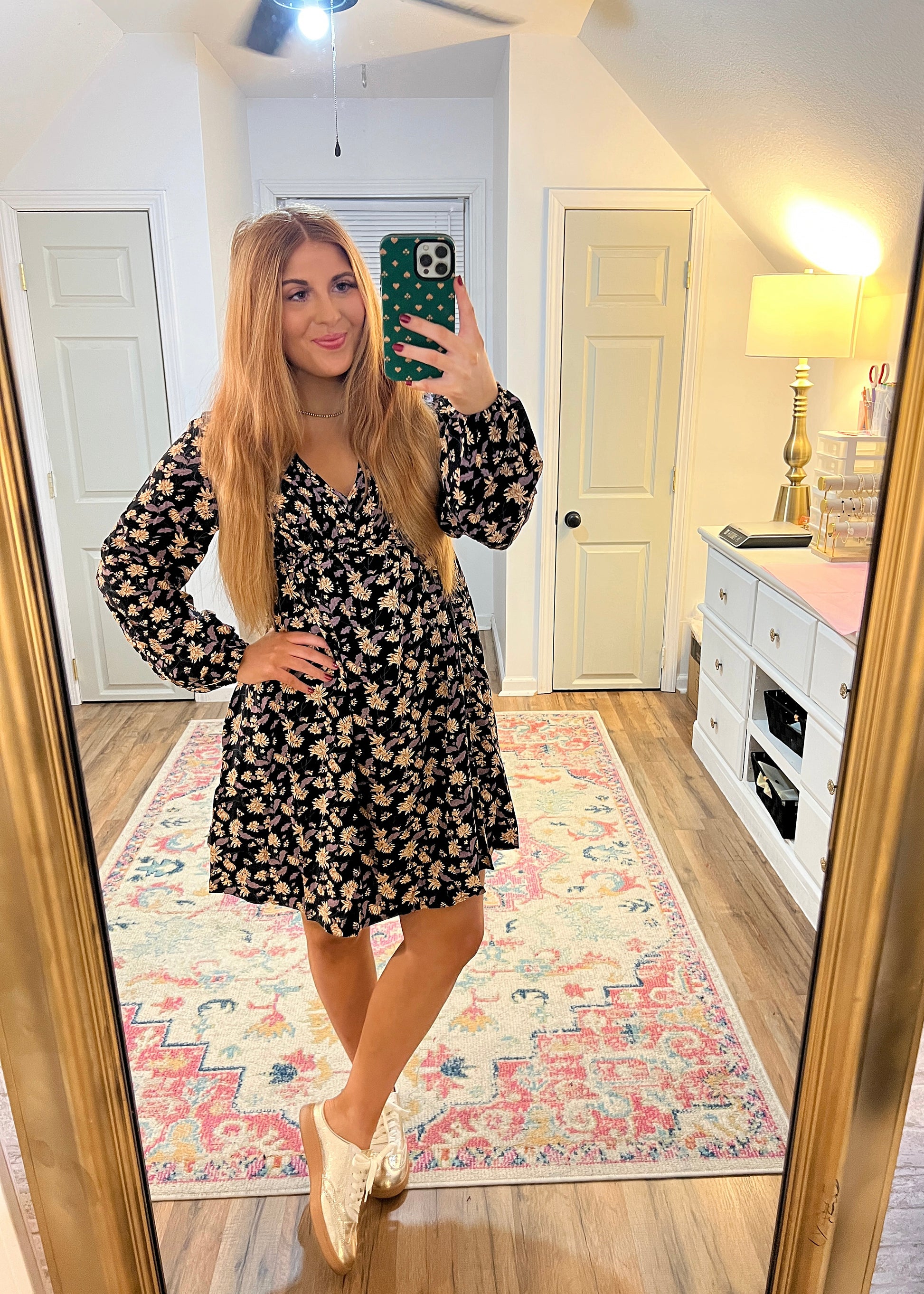 Black floral dress with a V-neckline and flattering fit