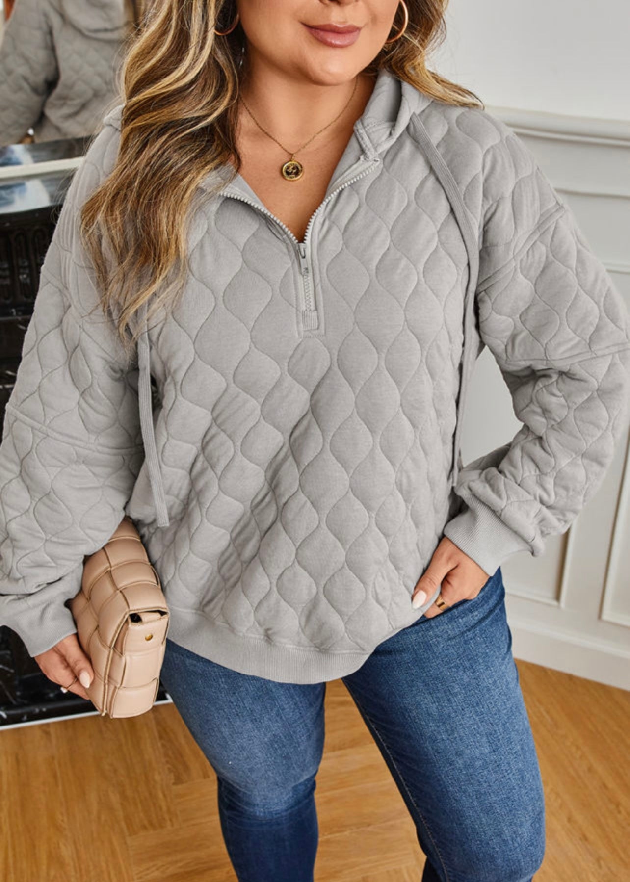 Grey quilted quarter zip pullover with long sleeves